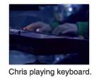 Chris playing keyboard.